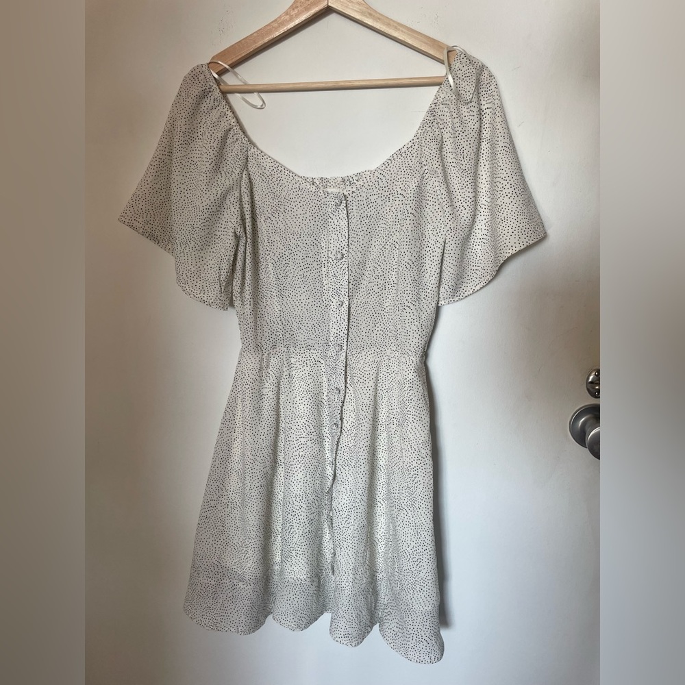 Tags on white dotted dress